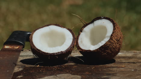 Fresh,-juicy-coconut-split-in-half-using-a-machete---zoom-out-reveal