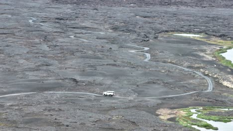Off-road-Camper-Truck-Driving-On-Track-Through-Lava-Fields-In-Iceland