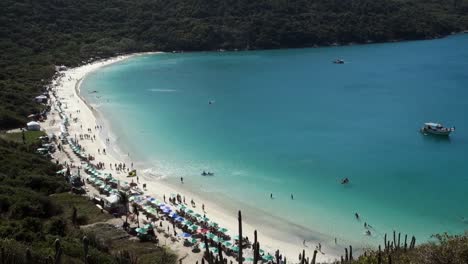 Aerial-tilt-up-view-of-idyllic-Forno-beach-in-Arraial-do-Cabo,-RJ,-Brazil