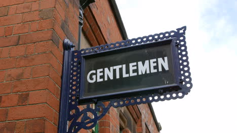 A-vintage-antique-gentlemen-toilet-wash-rest-room-sign-at-a-railway-train-station