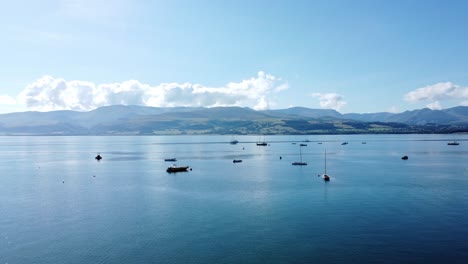 Snowdonia-clear-mountain-range-aerial-view-sunny-calm-Welsh-shimmering-blue-sky-seascape