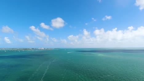 Parasail-b-roll-of-sky-from-2-people-Parasailing-with-green-and-blue-ocean-water-below-them-in-the-Florida-Keys-aerial-footage-2