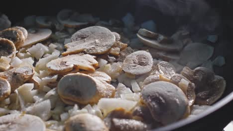 Sauteing-Mushroom-And-Onion-In-Pan,-Sprinkled-With-Seasoning-And-Spices