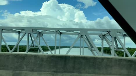 4k-Driving-across-steel-bridge-over-the-Mississippi-River-as-cars-pass-by-cable-old-road-trip-and-driving-tracking-b-roll