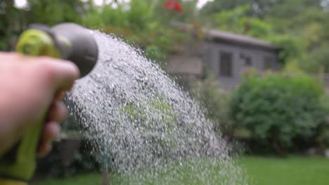 Garden-hose-watering-a-garden-in-slow-motion-1