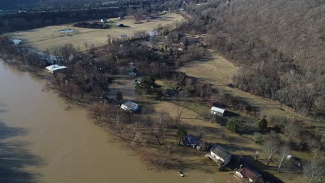 Aerial-top-down-view-of-American-homes-in-Kentucky-neighborhood-flooded-river-in-winter