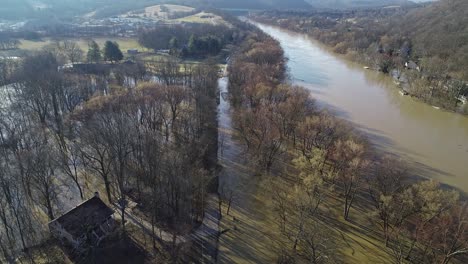 Aerial-of-flooded-river-and-submerged-road-in-American-neighborhood-of-Kentucky