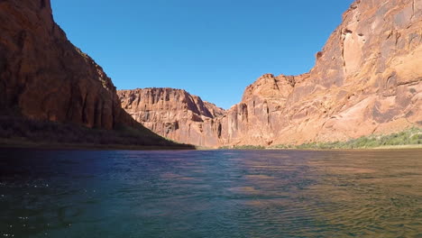The-rushing-waters-of-the-Colorado-river-along-the-Grand-Canyon-and-the-jagged-rocky-cliffs-of-the-Arizona-desert