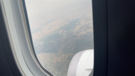 Shot-from-the-cockpit-of-the-city-plane-from-above-seen-through-the-window
