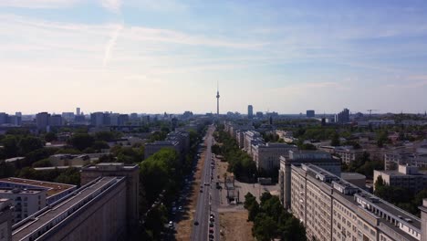 Multilane-road-leads-to-the-landmark-of-Berlin-television-tower-Gorgeous-aerial-view-flight-fly-forward-drone-footage
of-frankfurter-Tor-summer-day-2022