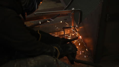 Welder-using-clamp-to-make-sure-welding-can-set-correctly-before-moving-onto-the-next-section