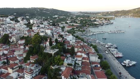Flying-over-the-harbor-and-the-city-of-Skiathos-in-Greece-in-4k