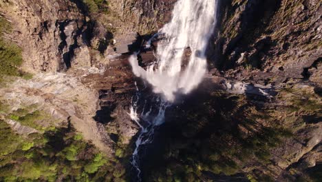 Aerial-drone-footage-with-top-down-views-of-a-picturesque-waterfall-in-spring-in-Grindelwald-in-the-Swiss-Alps