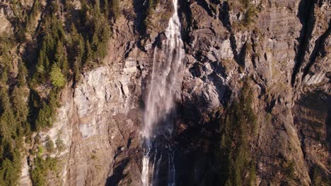 Aerial-drone-footage-pushing-out-at-scenic-Fallbach-in-Grindelwald,-Switzerland