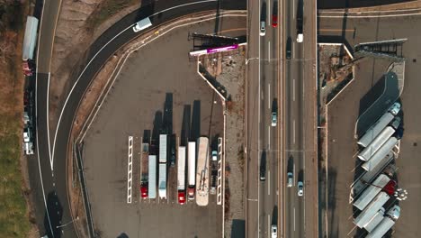 Truck-drivers-parked-parked-at-the-service-plaza-between-New-York-and-New-Jersey-on-I-95-aerial-footage-4k-bird-eye-view