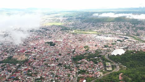 Aerial-view-of-a-road-and-a-Mexican-town-in-Oaxaca