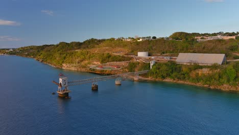 Full-View-rotating-slowly-left-Drone-Shot-of-a-Sugar-Cane-Pier-located-in-Aguadilla,-Puerto-Rico
