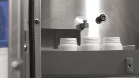 Pharmaceutical-packaging-machine-while-arranging-the-bottles,-Mobilak-Clean-Pack-Pharmaceutical-packaging---ISO-8-Clean-Room,-FDA-manufactured-according-to-GMP-requirements