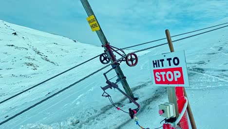 Emergency-stop-button-on-the-ski-slope-at-Hanmer-Ski-area-to-stop-the-nutcracker-cable-lift