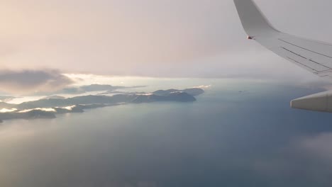 Flying-over-the-Picton-and-the-Marlborough-Sounds-in-South-Island-of-New-Zealand,-Aotearoa-on-a-cloudy-day