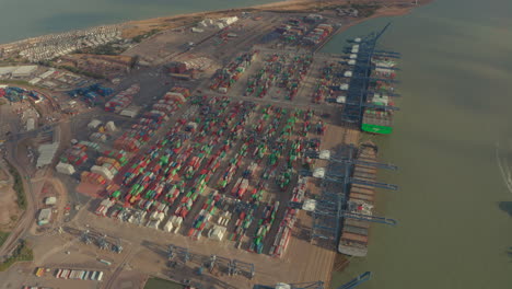 High-circling-aerial-shot-of-containers-waiting-to-be-loaded-port-of-felixstowe