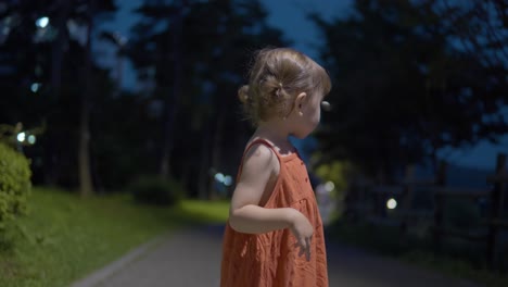 Portrait-Of-A-2-year-old-Caucasian-Toddler-In-The-Park-At-Night
