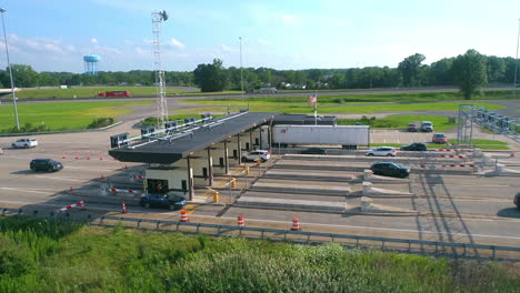 Aerial-view-of-afternoon-traffic-going-thru-an-Ohio-Expressway-Toll-Booth