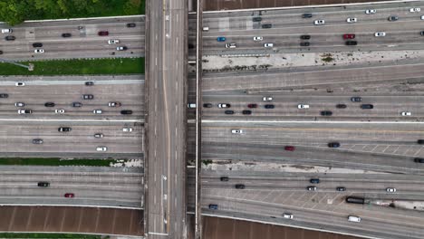 Aerial-view-above-traffic-on-the-Gulf-Fwy,-Interstate-45-and-10,-in-Houston,-USA---top-down,-drone-shot