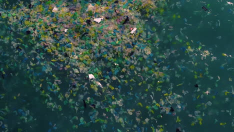 Water-Pollution-Concept---Colorful-Plastic-Bags-Floating-In-The-Surface-Of-Sea