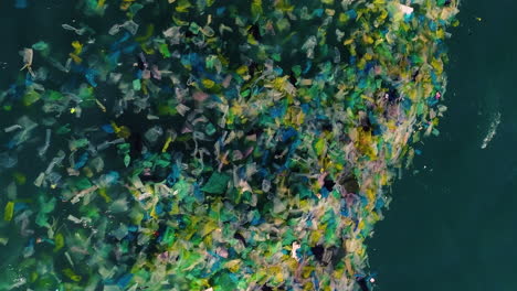 Vertical-Shot-Of-Tons-Of-Plastic-Garbage-Floating-In-The-Sea