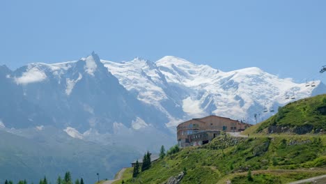 The-station-of-flagere-and-behind-the-view-of-mont-blanc-in-a-sunny-day,-in-the-valley-of-chamonix,-in-france