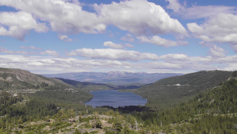 4K-timelapse-of-Donner-Lake-in-Truckee-Northern-California-Near-Lake-Tahoe,-with-clouds-passing-overhead-and-trees-surround-the-blue-lake