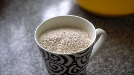 Cup-Full-Of-Powdered-Walnuts-For-Baking