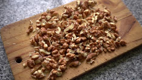 Chopped-Walnuts-On-Wooden-Chopping-Board