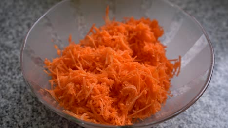 Bowl-Of-Grated-Carrots,-Ingredient-For-Carrot-Cake