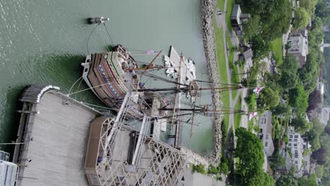Mayflower-II-wooden-17th-century-ship-docked-in-Plymouth,-USA---Vertical-aerial-view