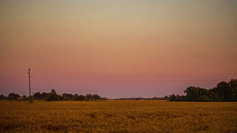 Nightfall-over-farmland-the-a-new-super-moon-rising-over-the-countryside---time-lapse