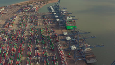 Low-aerial-shot-over-Container-yard-and-loading-cranes-at-port-of-felixstowe