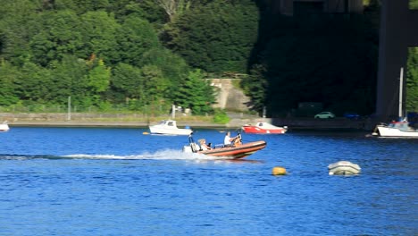 A-Small-Dinghy-With-a-Motor-Speeding-Down-the-River-Tamar-near-Saltash-in-Cornwall