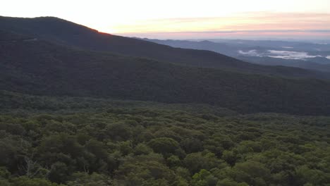 Aerial-panning-the-treetops-below-grandfather-mountain-nc-at-sunrise