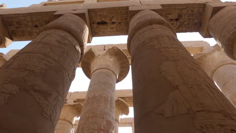 View-of-ancient-columns-with-hieroglyphs-in-the-Karnak-temple-complex,-famous-monument-with-inscriptions-and-reliefs