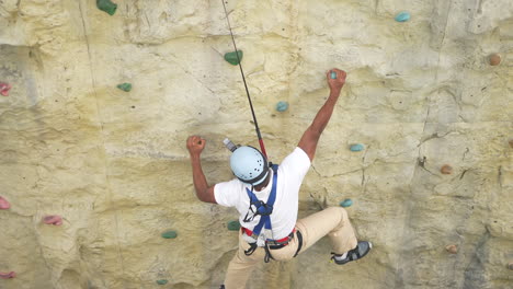 One-man-is-playing-wolltopia-Rock-climbing-walls-game-on-a-cruise-in-Singapore