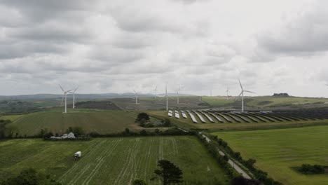 Dramatic-View-Of-Wind-Turbines-And-Solar-Panels-Near-Saint-Newlyn-East-Countryside-In-Cornwall,-England,-United-Kingdom