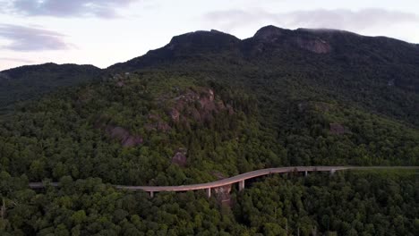 Car-drives-along-the-blue-ridge-parkway-viaduct-aerial