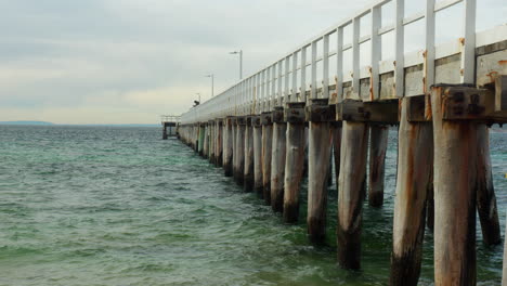 SLOW-MOTION-Old-Wooden-Jetty-On-Cloudy-Cold-Winters-Day