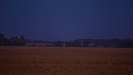 Darkness-comes-a-nightfall-over-farmland-in-rural-Europe---time-lapse