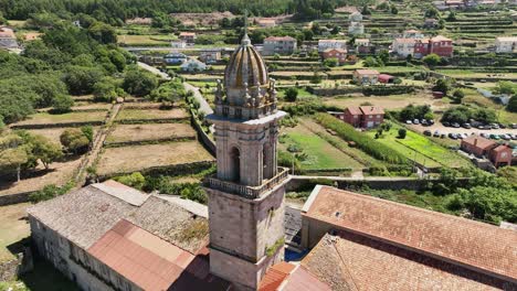 Drone-view-circling-the-bell-tower-of-the-monastery-of-oia-in-Santa-Maria-de-oya