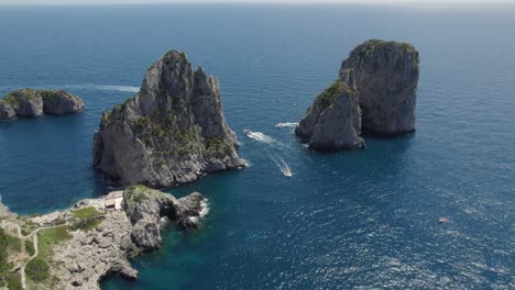 Faraglioni-Rock-Formations-on-Capri-Island-Coast,-Italy---Drone-Shot