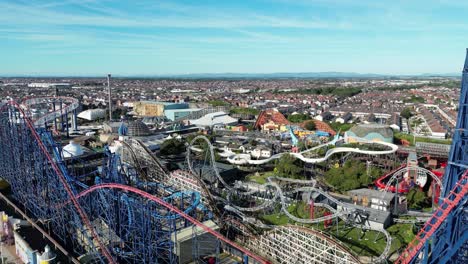 Aerial-drone-flight-around-Blackpool-Pleasure-Beach-showing-a-detailed-view-inside-the-Themepark-and-the-rollercoaster-rides