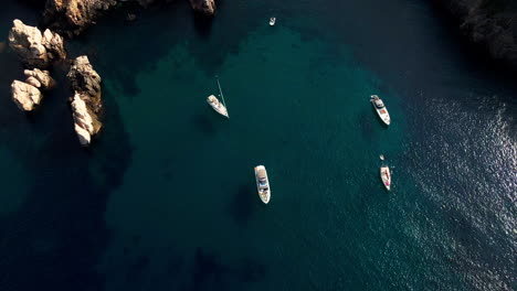 Luxury-yachts-and-speedboats-in-exclusive-Spanish-cove-with-beautiful-clear-turquoise-water